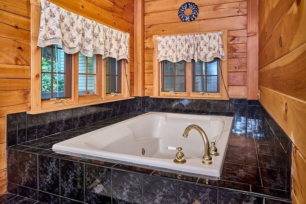 171 Tatro Road Ashfield, MA 01330 - Photo 24 of 42 a bathroom with a bathtub and a window