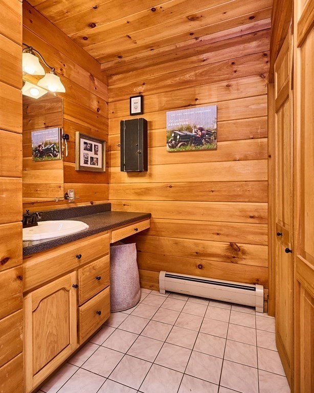 171 Tatro Road Ashfield, MA 01330 - Photo 28 of 42 a view of a bathroom with a sink and a mirror