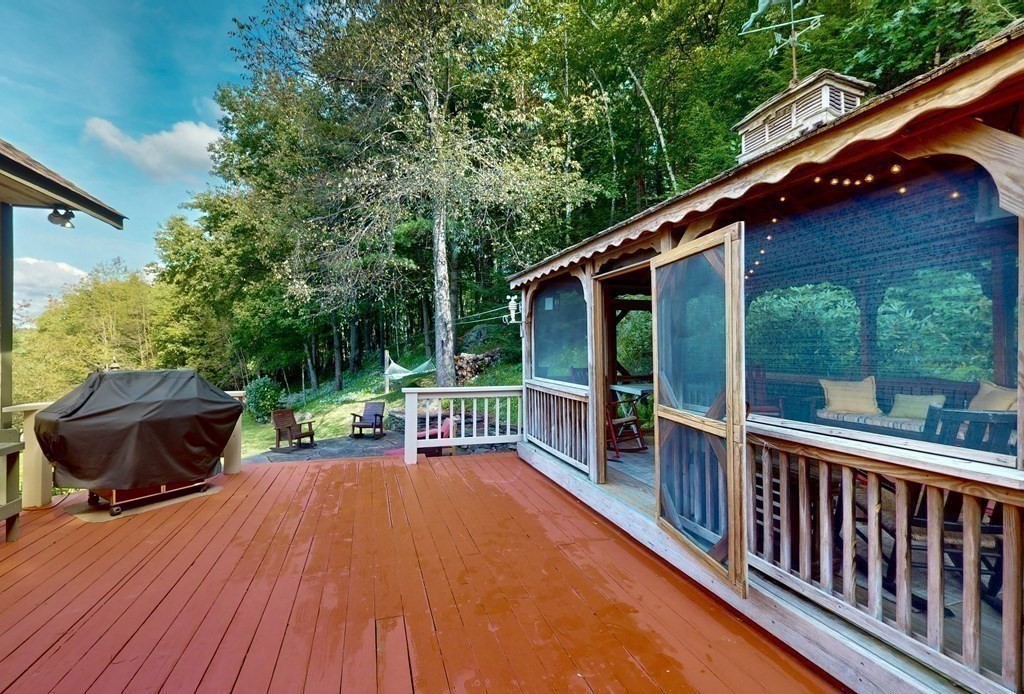 171 Tatro Road Ashfield, MA 01330 - Photo 30 of 42 a view of a chairs and table on the wooden deck