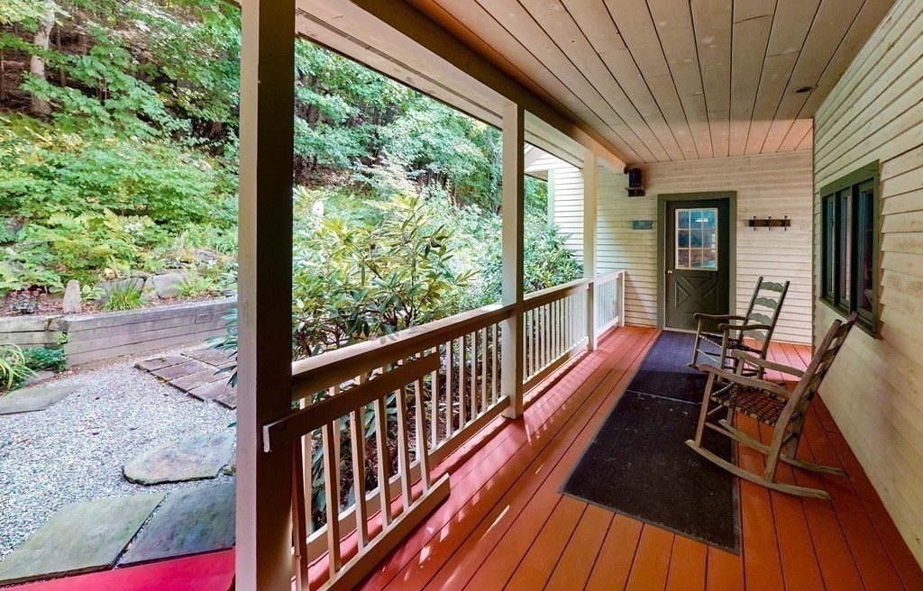 171 Tatro Road Ashfield, MA 01330 - Photo 6 of 42 a view of a balcony with chairs and wooden floor