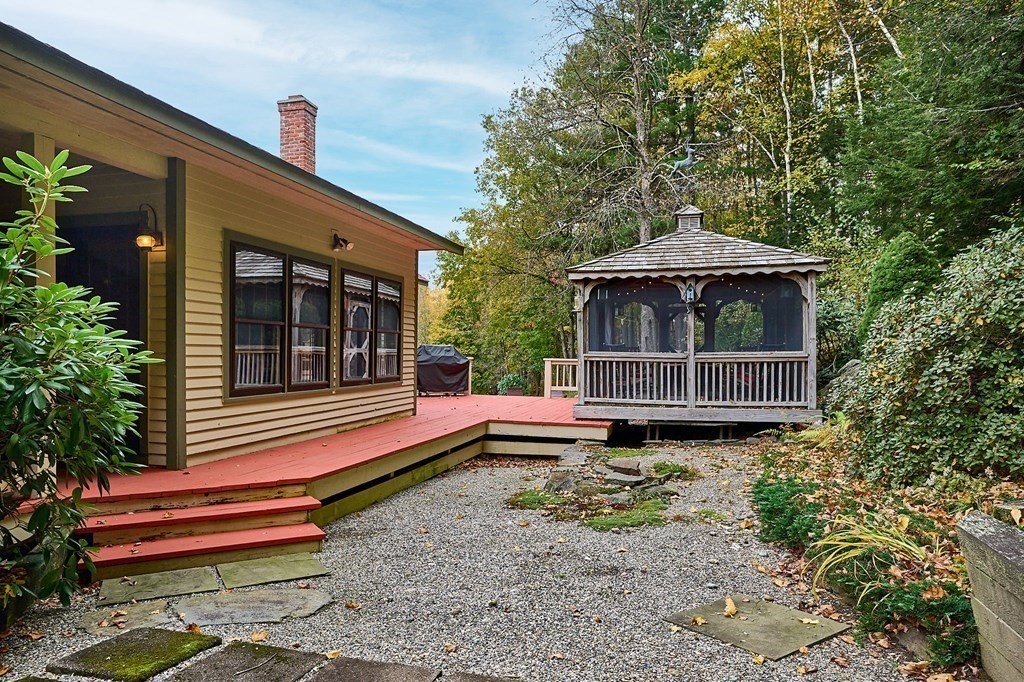 171 Tatro Road Ashfield, MA 01330 - Photo 8 of 42 a wooden bench sitting in front of a house