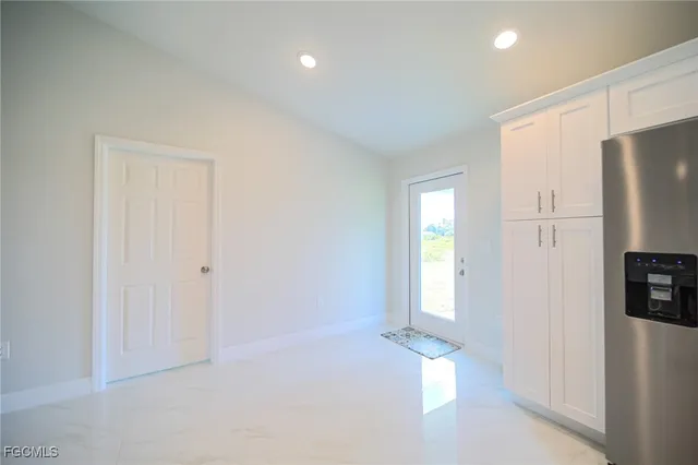 a view of empty room with front door