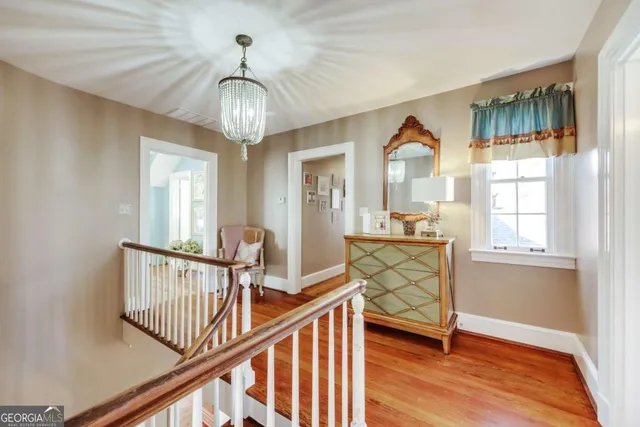 a spacious bathroom with a double vanity sink a mirror and a shower