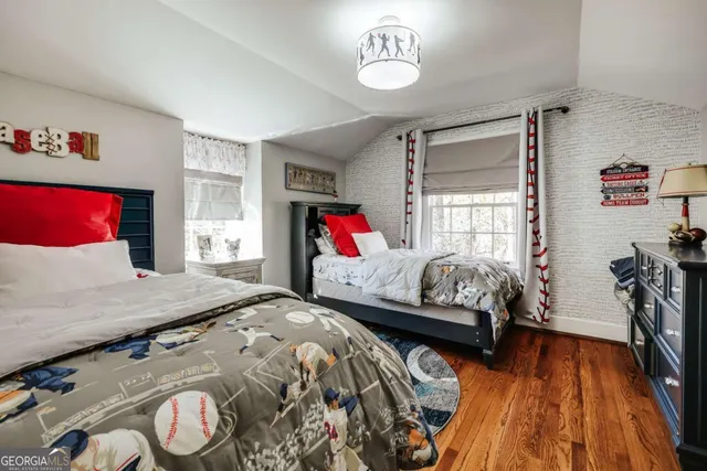 a front view of a house with a yard covered with snow