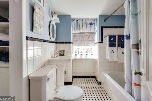 a front view of a house with a small yard