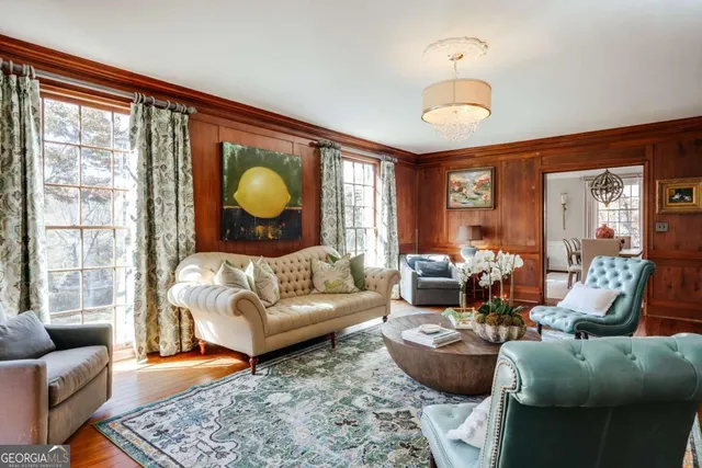 a view of a dining room with furniture window and wooden floor