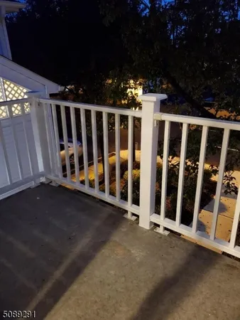 a view of backyard with outdoor seating and trees