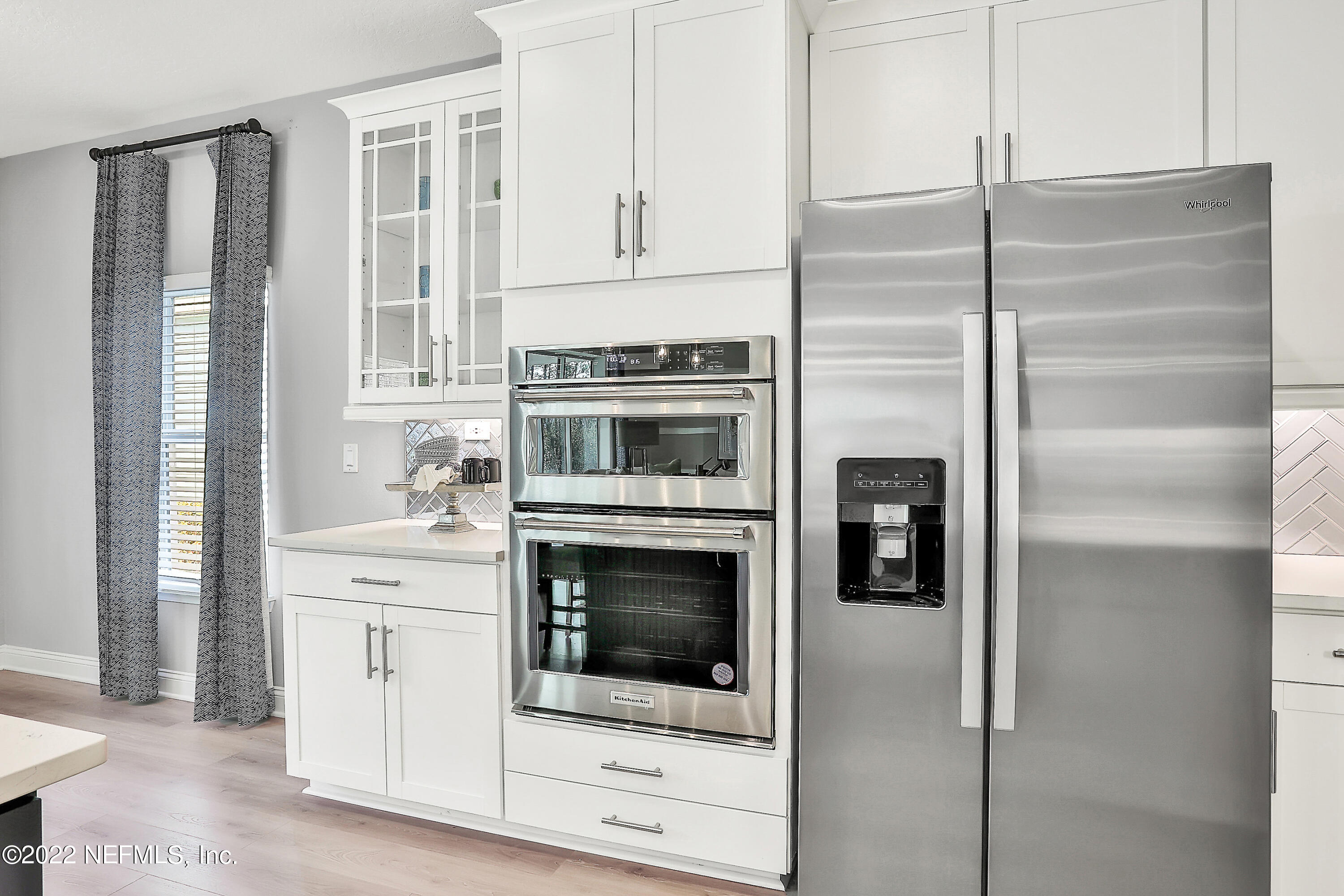 117 Crew Court St. Augustine, FL 32092 - Photo 24 of 64 a kitchen with stainless steel appliances cabinets and a counter top space