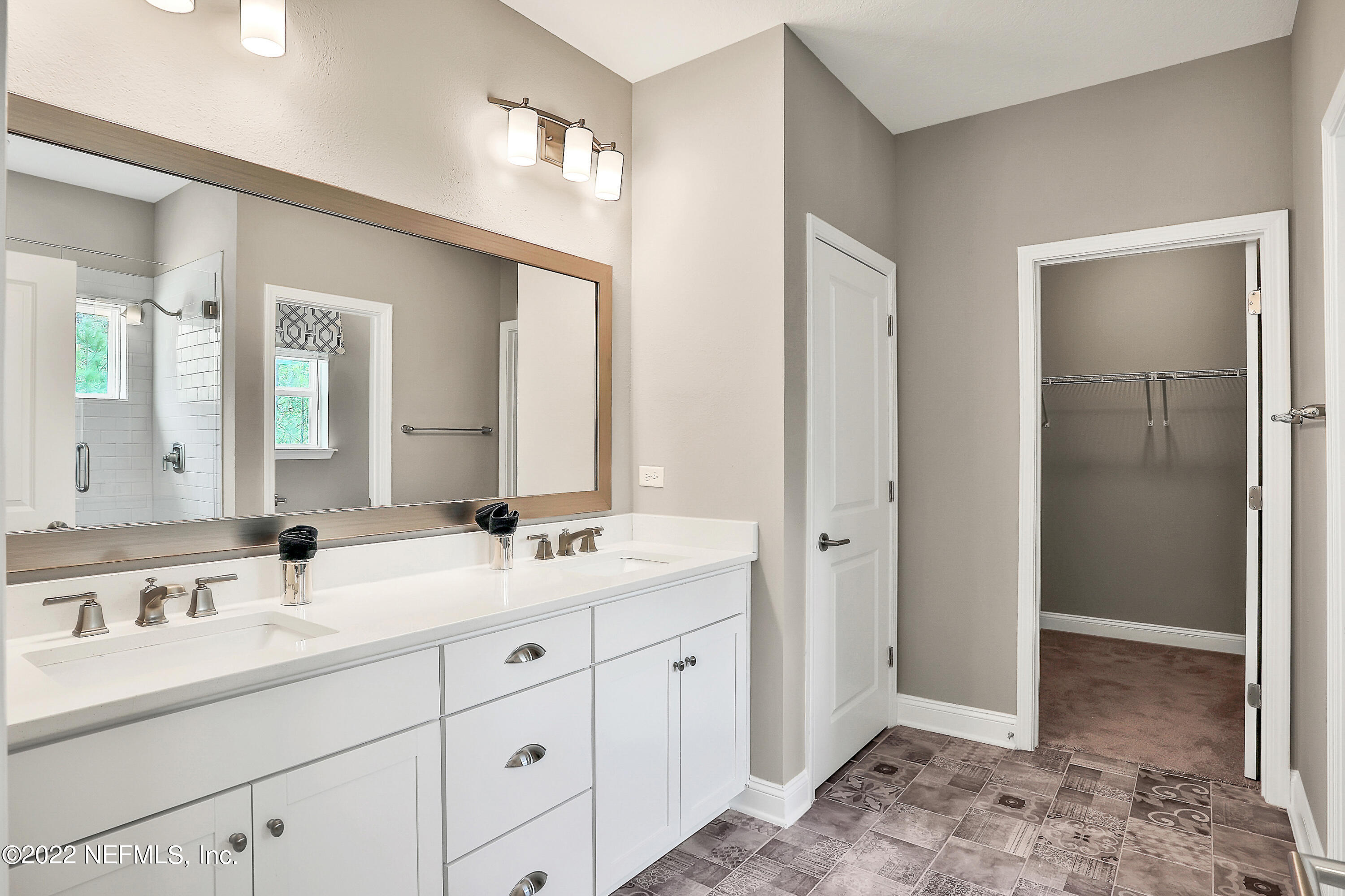 117 Crew Court St. Augustine, FL 32092 - Photo 43 of 64 a spacious bathroom with a double vanity sink mirror and double