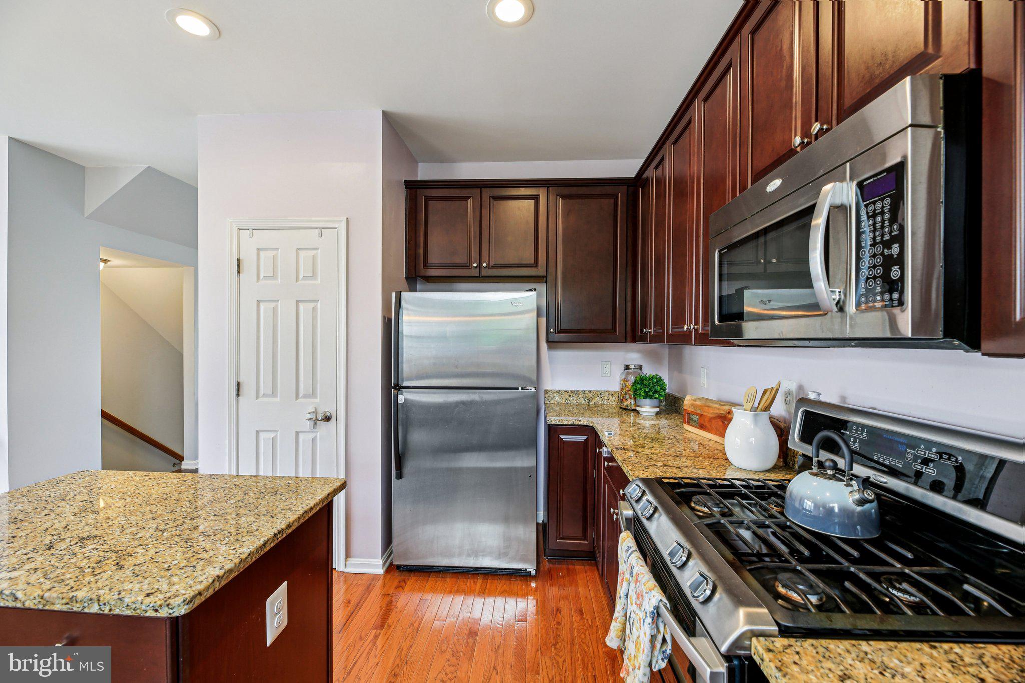 690 Tivoli Road Frederick, MD 21703 - Photo 11 of 43 a kitchen with granite countertop stove and refrigerator