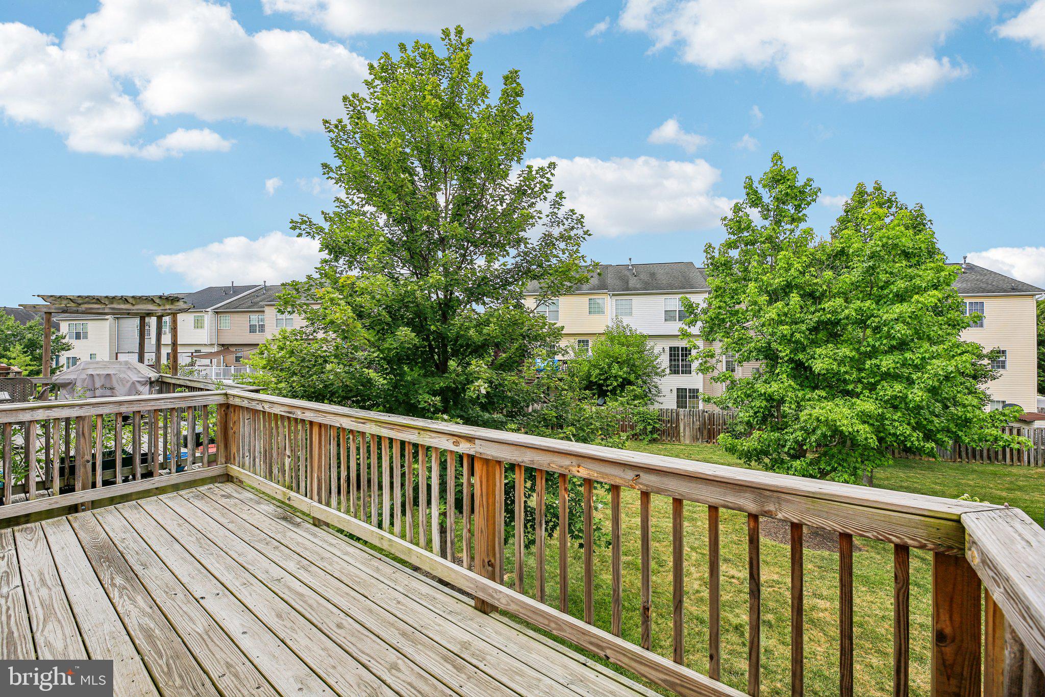 690 Tivoli Road Frederick, MD 21703 - Photo 17 of 43 a view of balcony with wooden floor and fence