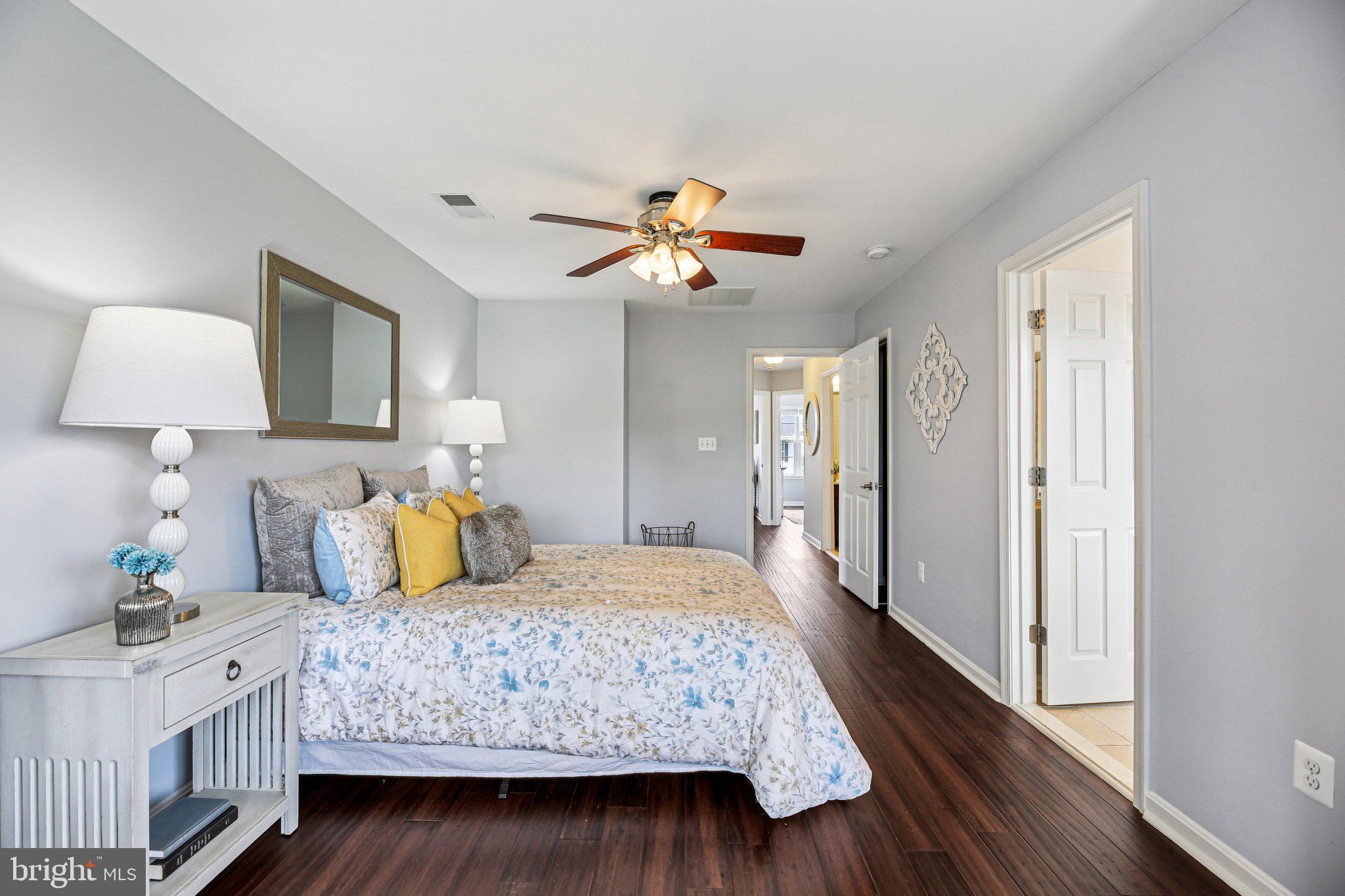 690 Tivoli Road Frederick, MD 21703 - Photo 20 of 43 a bedroom with a bed and a chandelier
