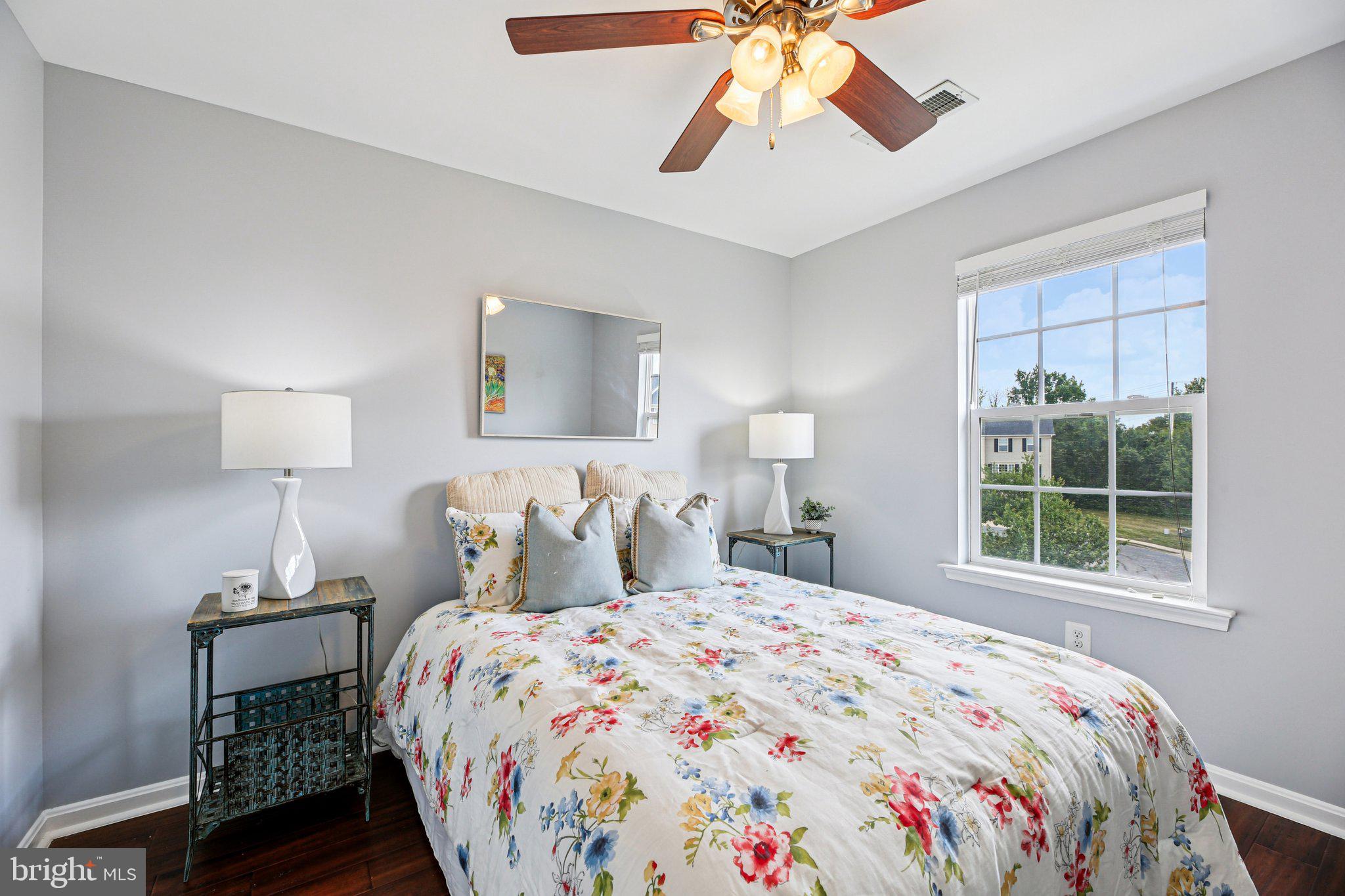 690 Tivoli Road Frederick, MD 21703 - Photo 25 of 43 a bedroom with a large bed and a window