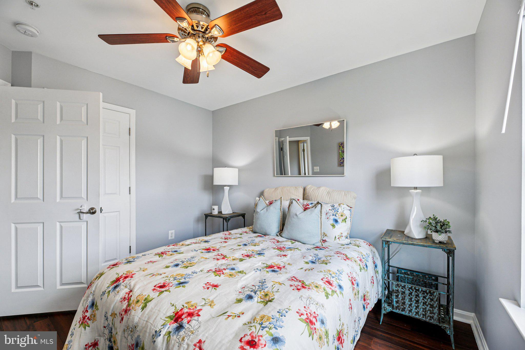 690 Tivoli Road Frederick, MD 21703 - Photo 26 of 43 a bedroom with a bed and a chandelier