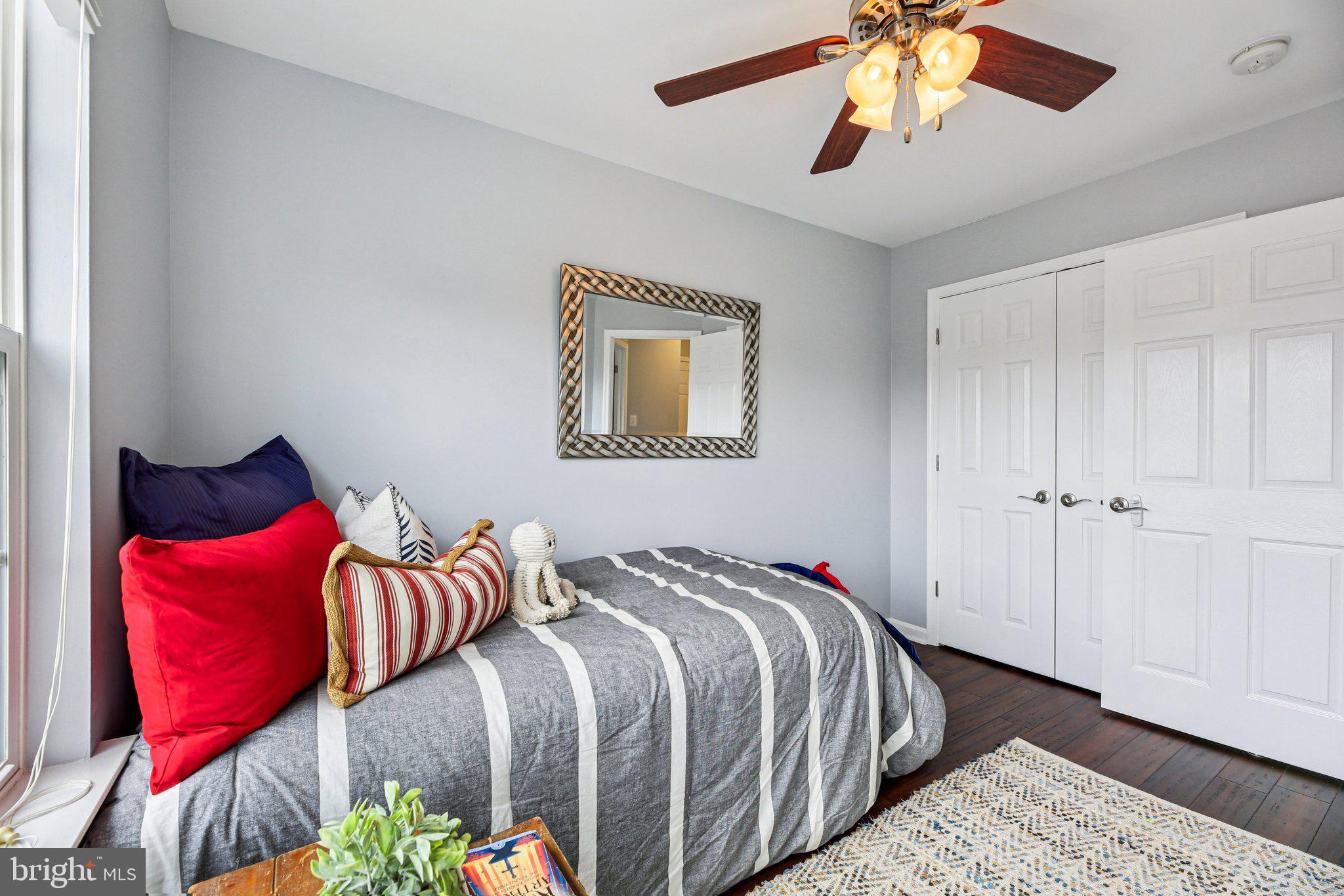 690 Tivoli Road Frederick, MD 21703 - Photo 28 of 43 a bedroom with bed and a chandelier