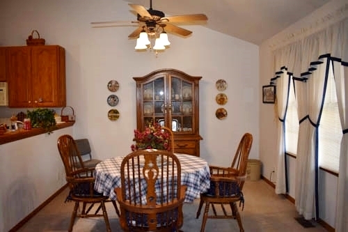 25109 Indian Ridge Road Sterling, IL 61081 - Photo 16 of 34 a view of a dining room with furniture and a chandelier