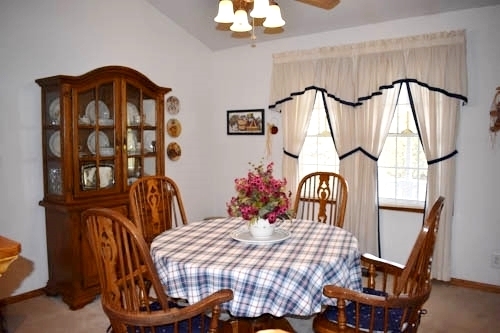 25109 Indian Ridge Road Sterling, IL 61081 - Photo 17 of 34 a bedroom with a bed and a chandelier