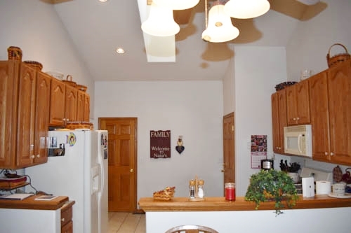 25109 Indian Ridge Road Sterling, IL 61081 - Photo 21 of 34 a kitchen with stainless steel appliances granite countertop a refrigerator and a stove top oven