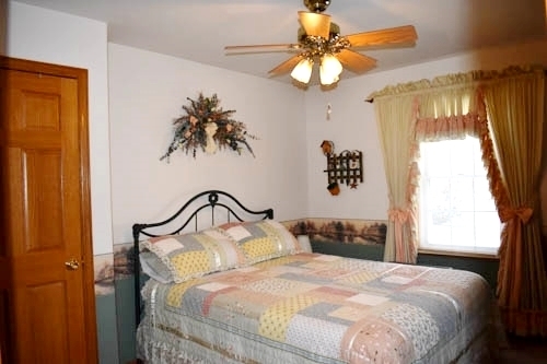 25109 Indian Ridge Road Sterling, IL 61081 - Photo 23 of 34 a bedroom with a bed and a window