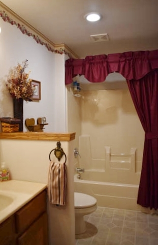 25109 Indian Ridge Road Sterling, IL 61081 - Photo 26 of 34 a bathroom with a bathtub shower sink and toilet
