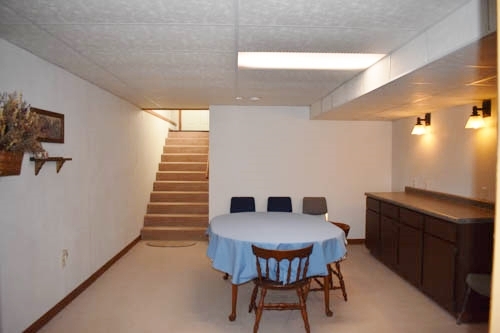 25109 Indian Ridge Road Sterling, IL 61081 - Photo 29 of 34 a view of a dining room with furniture and wooden floor
