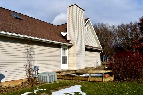 25109 Indian Ridge Road Sterling, IL 61081 - Photo 7 of 34 a view of backyard of house and car parked