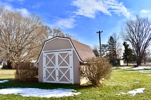 25109 Indian Ridge Road Sterling, IL 61081 - Photo 10 of 34 a view of swimming pool with a yard