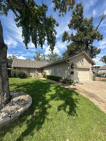a view of a house with a big yard