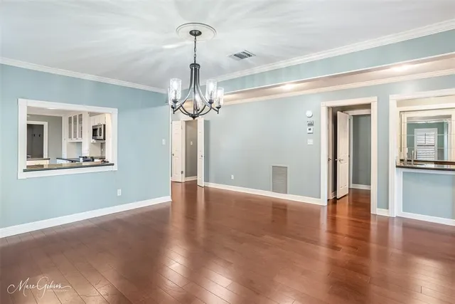 a kitchen with granite countertop a sink and cabinets