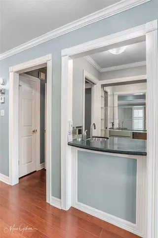 a view of a livingroom with a fireplace a ceiling fan and fire place