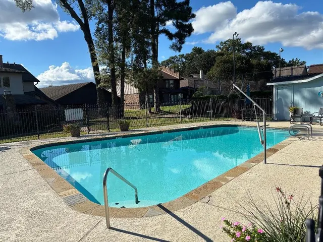 a view of a park with large trees