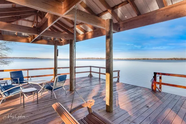 a view of a patio with wooden floor