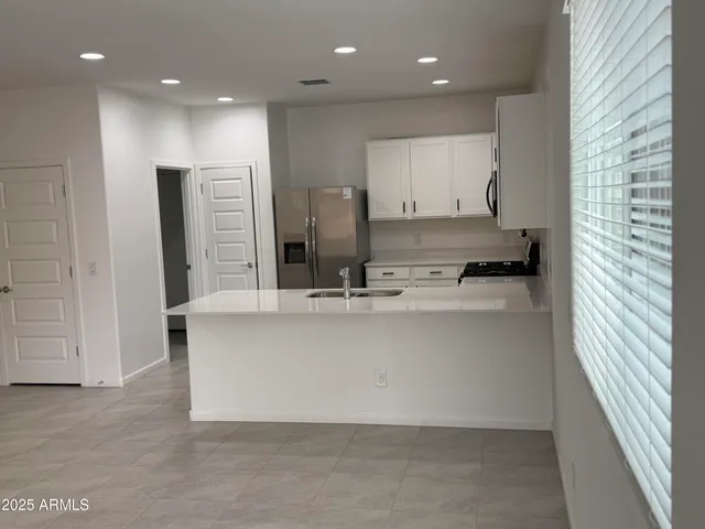 a view of kitchen with counter top space