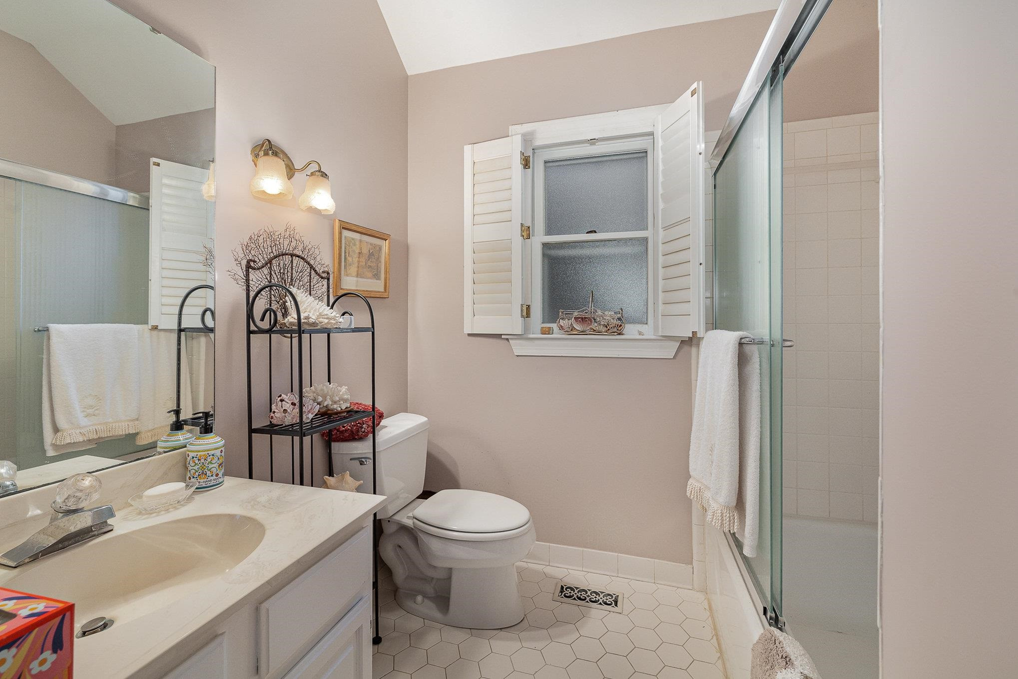 1829 Falls Church Road Raleigh, NC 27609 - Photo 16 of 30 a bathroom with a toilet sink and mirror