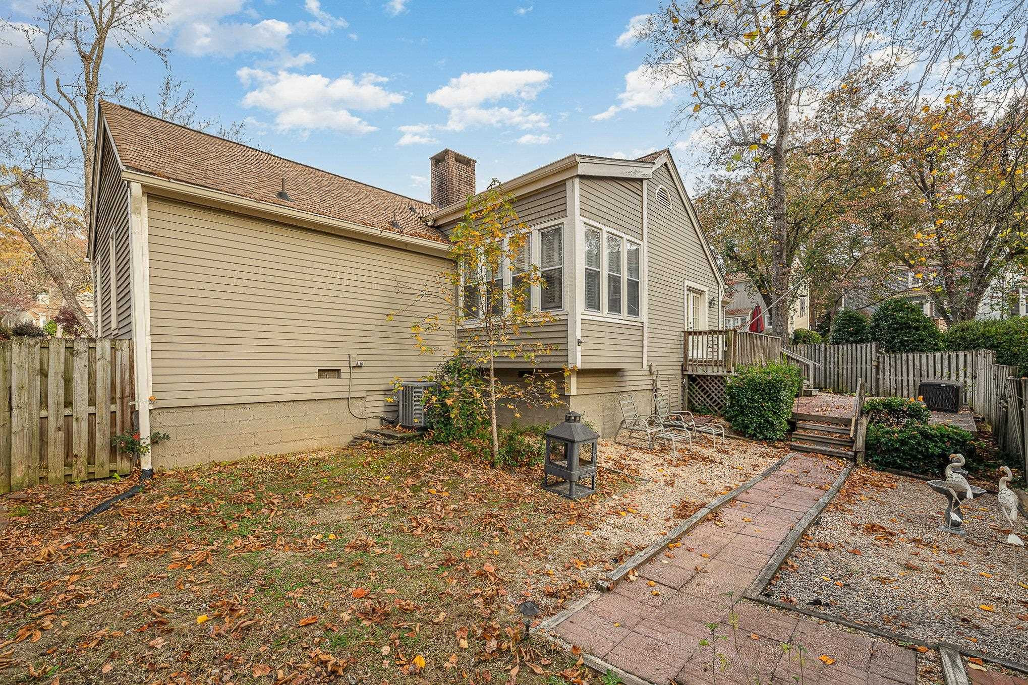 1829 Falls Church Road Raleigh, NC 27609 - Photo 28 of 30 a backyard of a house with table and chairs