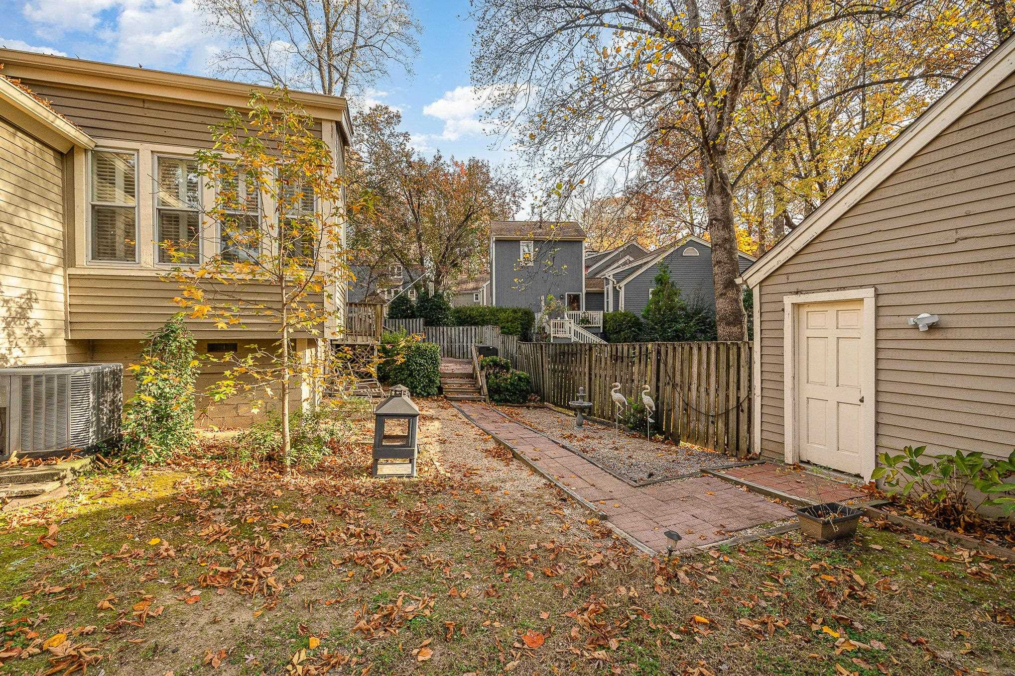 1829 Falls Church Road Raleigh, NC 27609 - Photo 29 of 30 a view of a brick house with a yard