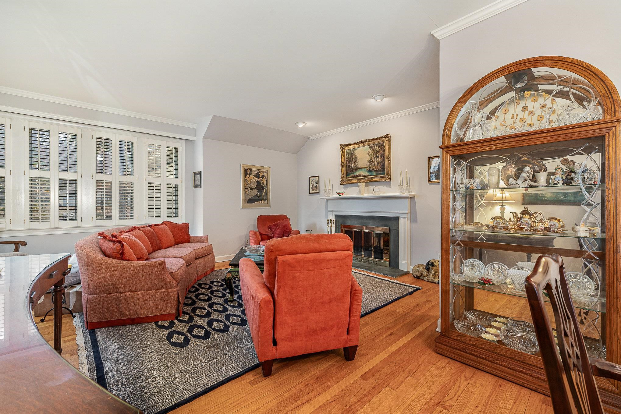 1829 Falls Church Road Raleigh, NC 27609 - Photo 5 of 30 a living room with furniture a fireplace and a flat screen tv