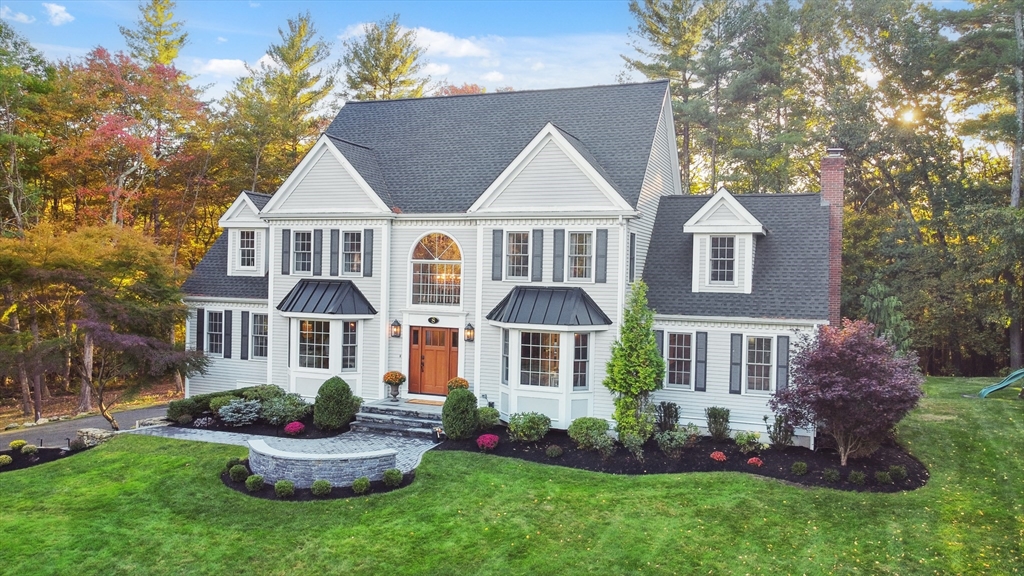 8 MacIntyre Drive North Reading, MA 01864 - Photo 1 of 42 a front view of house with yard and green space