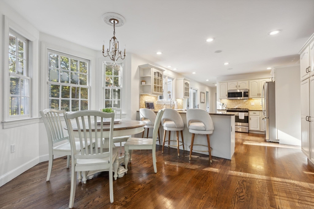 8 MacIntyre Drive North Reading, MA 01864 - Photo 11 of 42 a view of a dining room with furniture window and wooden floor
