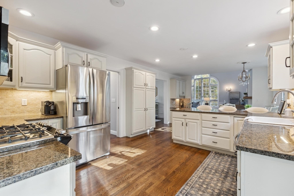 8 MacIntyre Drive North Reading, MA 01864 - Photo 13 of 42 a kitchen with stainless steel appliances granite countertop a refrigerator sink and stove