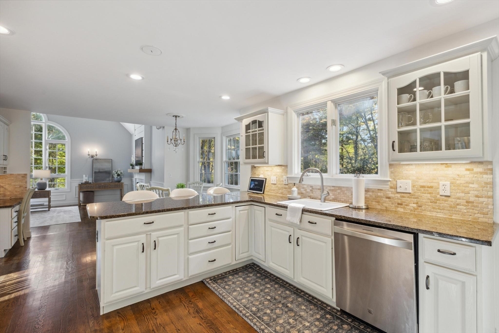8 MacIntyre Drive North Reading, MA 01864 - Photo 14 of 42 a kitchen with a sink stove and cabinets