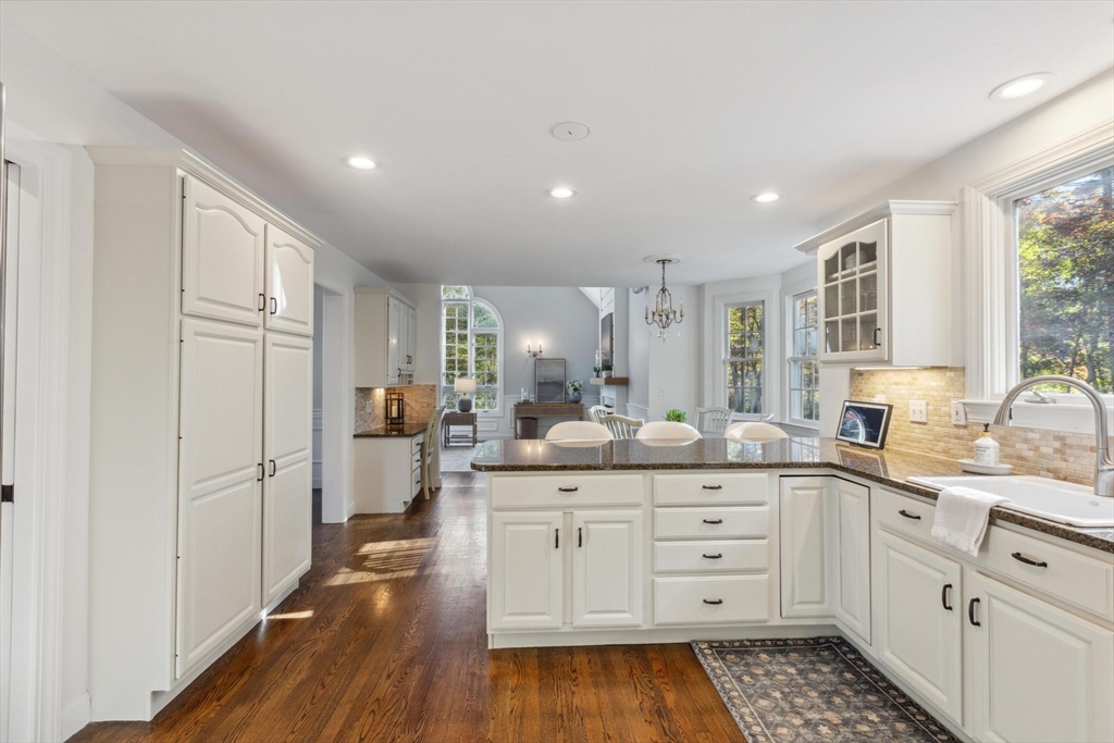 8 MacIntyre Drive North Reading, MA 01864 - Photo 15 of 42 a kitchen with white cabinets and sink