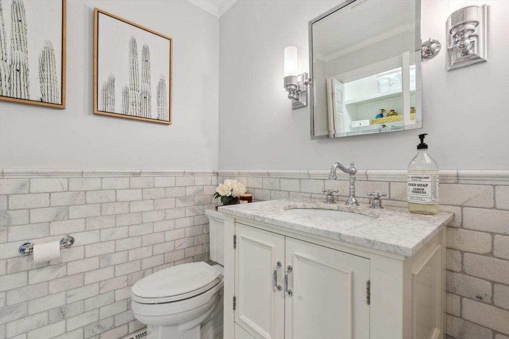 8 MacIntyre Drive North Reading, MA 01864 - Photo 19 of 42 a bathroom with a granite countertop toilet sink and mirror