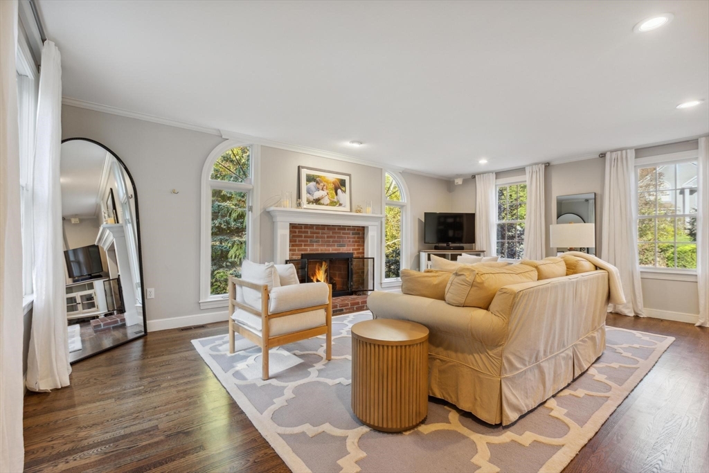 8 MacIntyre Drive North Reading, MA 01864 - Photo 20 of 42 a living room with fireplace furniture and a wooden floor