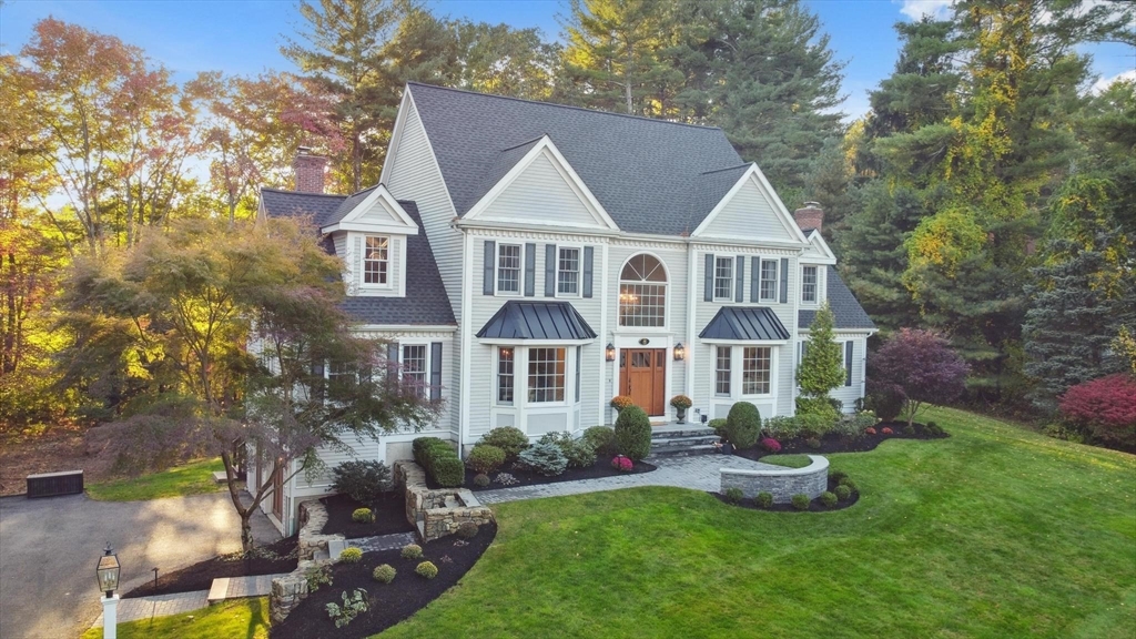 8 MacIntyre Drive North Reading, MA 01864 - Photo 2 of 42 a front view of house with yard and green space
