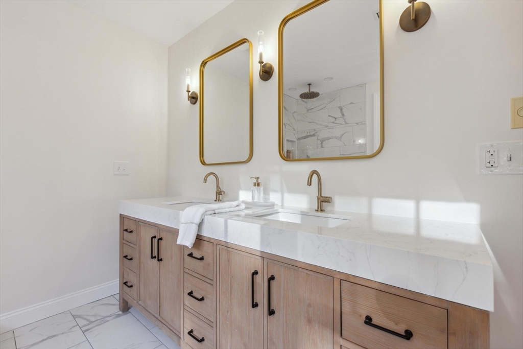 8 MacIntyre Drive North Reading, MA 01864 - Photo 29 of 42 a bathroom with a granite countertop sink mirror and double