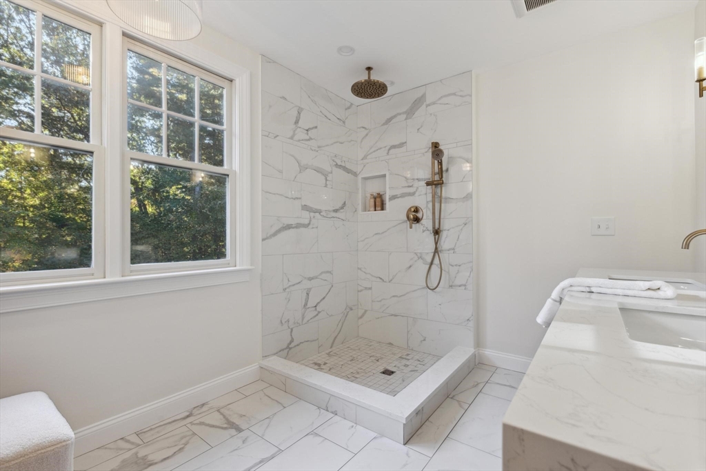 8 MacIntyre Drive North Reading, MA 01864 - Photo 30 of 42 a bathroom with a tub shower and window