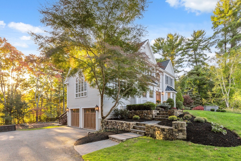 8 MacIntyre Drive North Reading, MA 01864 - Photo 3 of 42 a front view of a house with garden