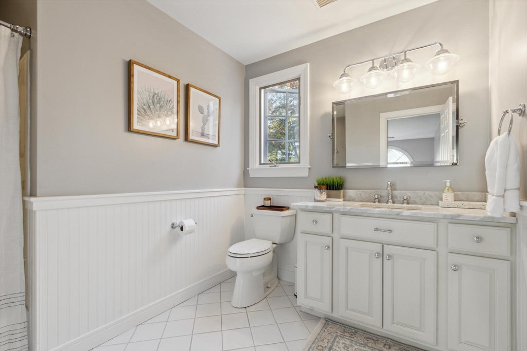 8 MacIntyre Drive North Reading, MA 01864 - Photo 35 of 42 a bathroom with a toilet sink and mirror