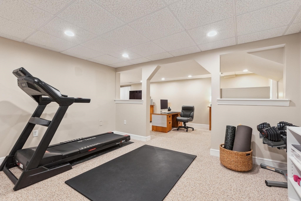 8 MacIntyre Drive North Reading, MA 01864 - Photo 37 of 42 a room with gym equipment and a table